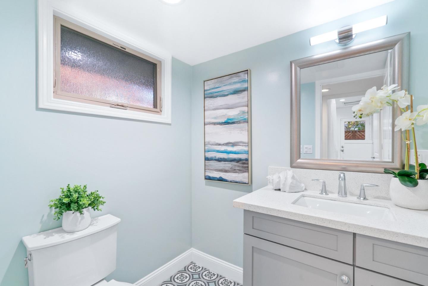 777 Rustic Lane Mountain View, CA 94040 - Photo 21 of 44 a bathroom with a toilet a sink and mirror