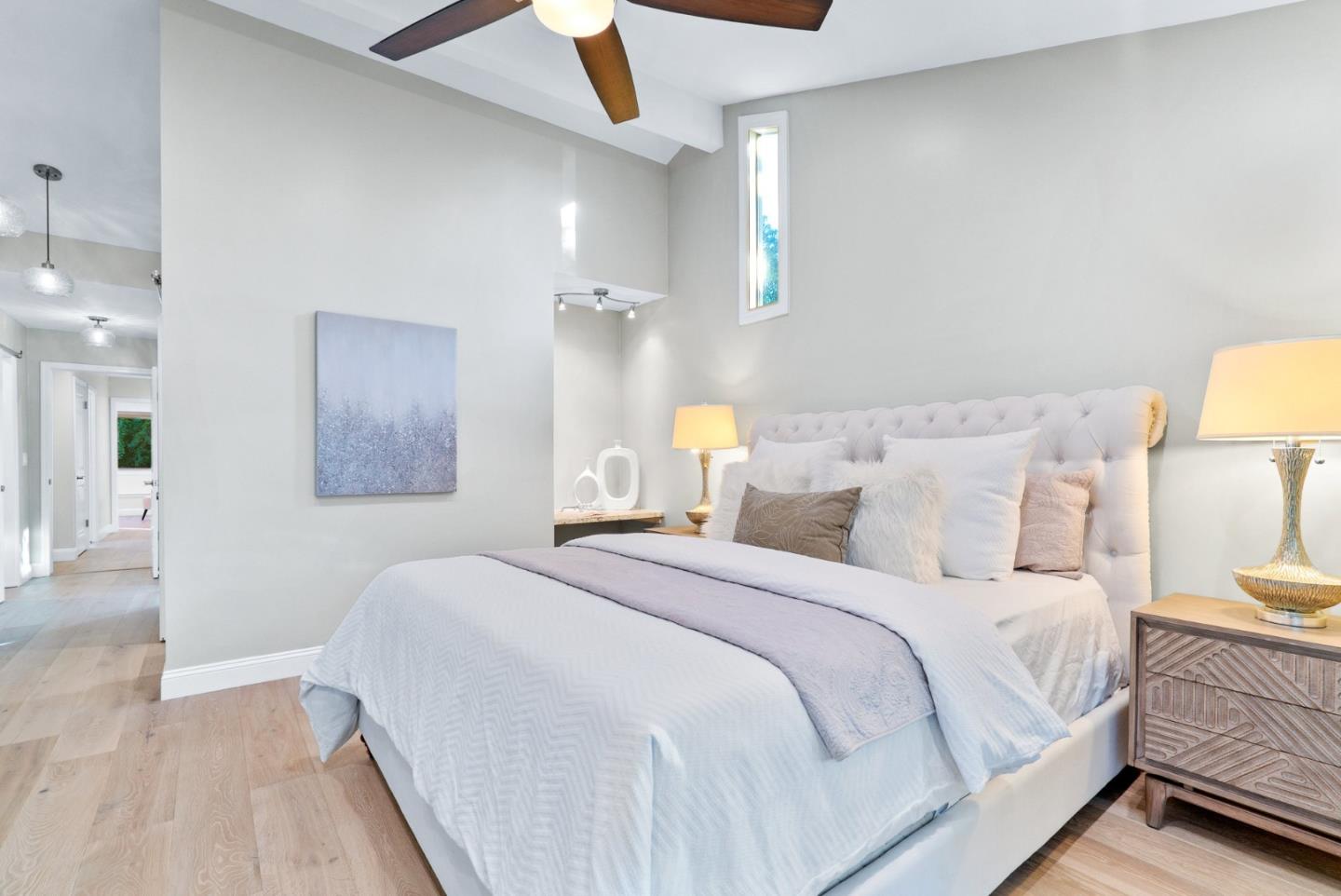777 Rustic Lane Mountain View, CA 94040 - Photo 24 of 44 a bedroom with a bed and a lamp