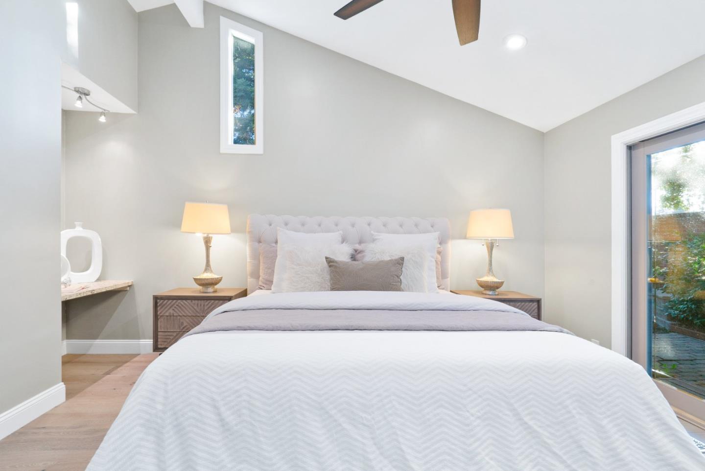 777 Rustic Lane Mountain View, CA 94040 - Photo 25 of 44 a bedroom with a bed and a lamp