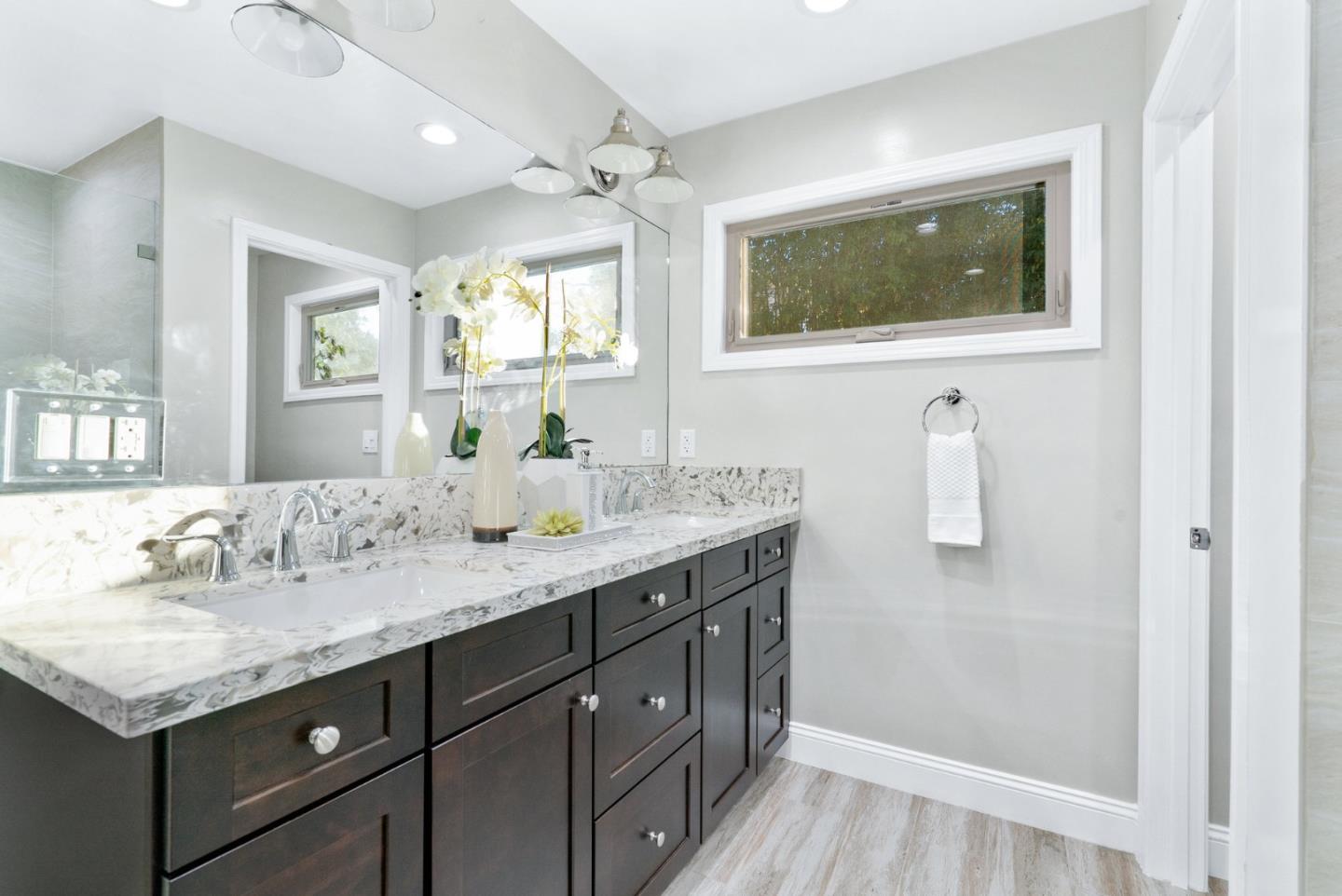 777 Rustic Lane Mountain View, CA 94040 - Photo 27 of 44 a bathroom with a granite countertop sink and a mirror