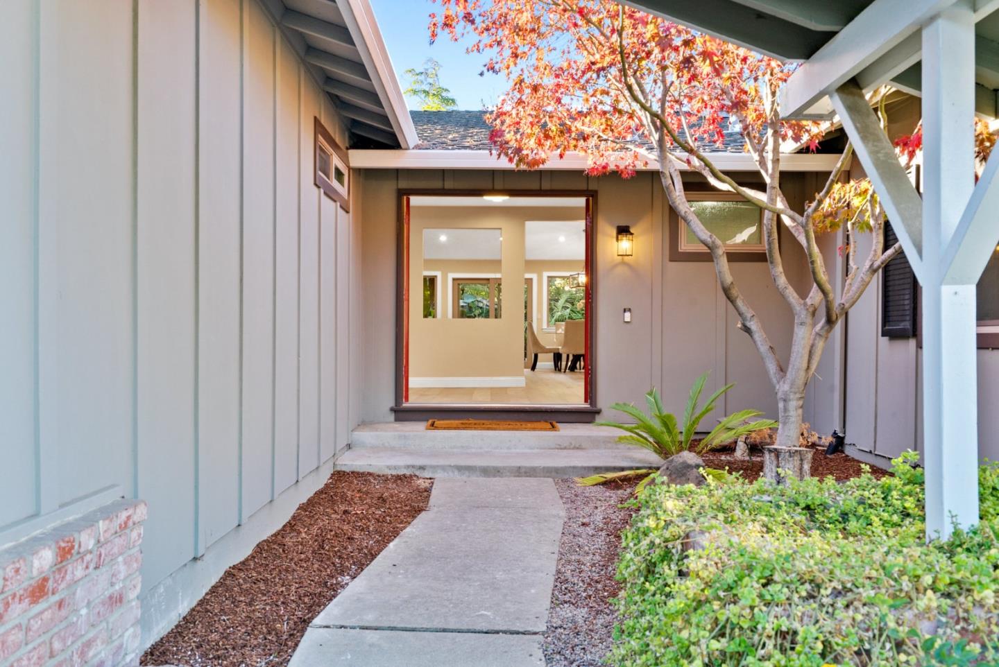 777 Rustic Lane Mountain View, CA 94040 - Photo 4 of 44 a front view of a house with a yard