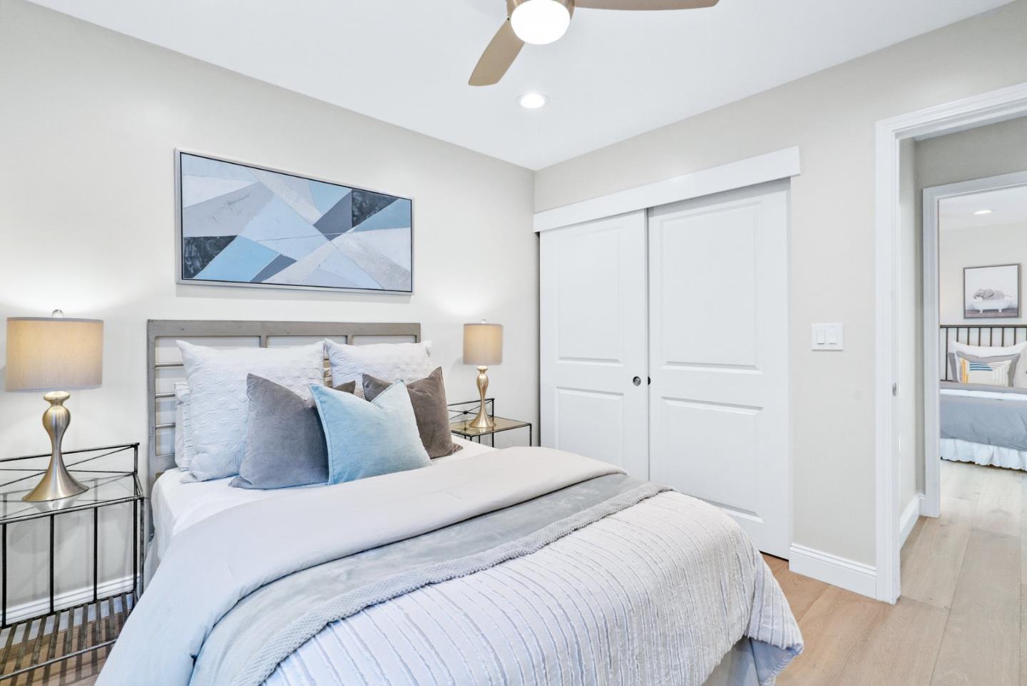 777 Rustic Lane Mountain View, CA 94040 - Photo 32 of 44 a bedroom with a bed and a painting on the wall