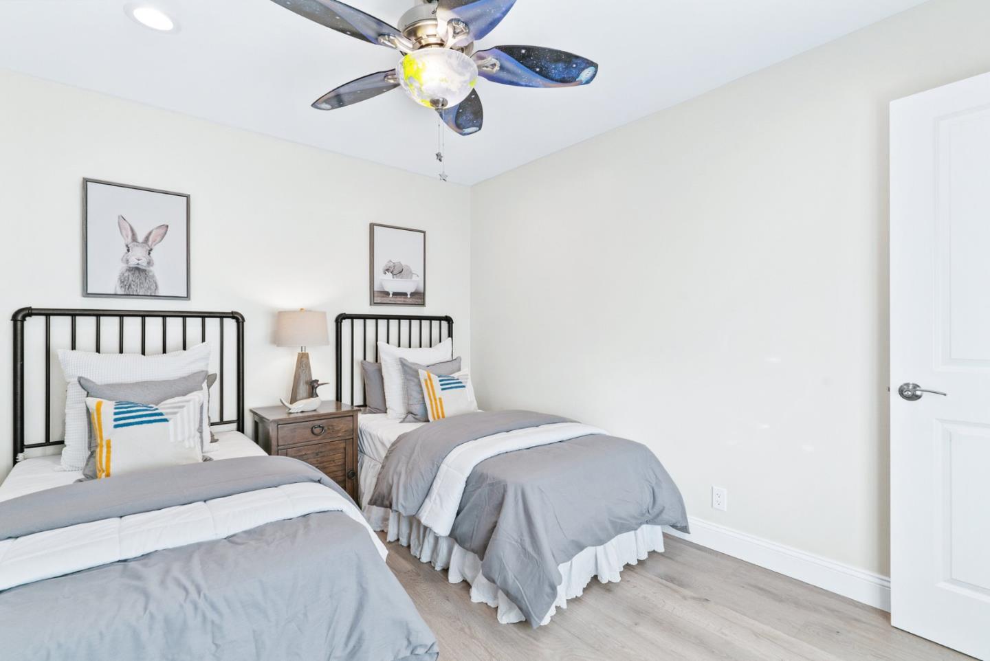 777 Rustic Lane Mountain View, CA 94040 - Photo 34 of 44 a bedroom with two beds and a chandelier