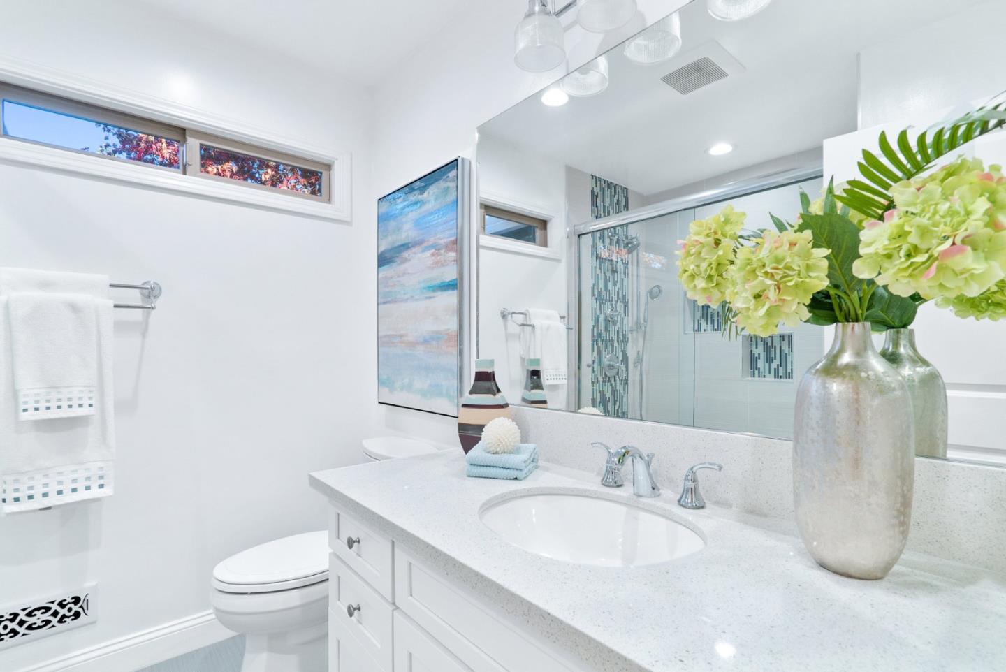 777 Rustic Lane Mountain View, CA 94040 - Photo 35 of 44 a bathroom with a granite countertop sink a toilet and a mirror
