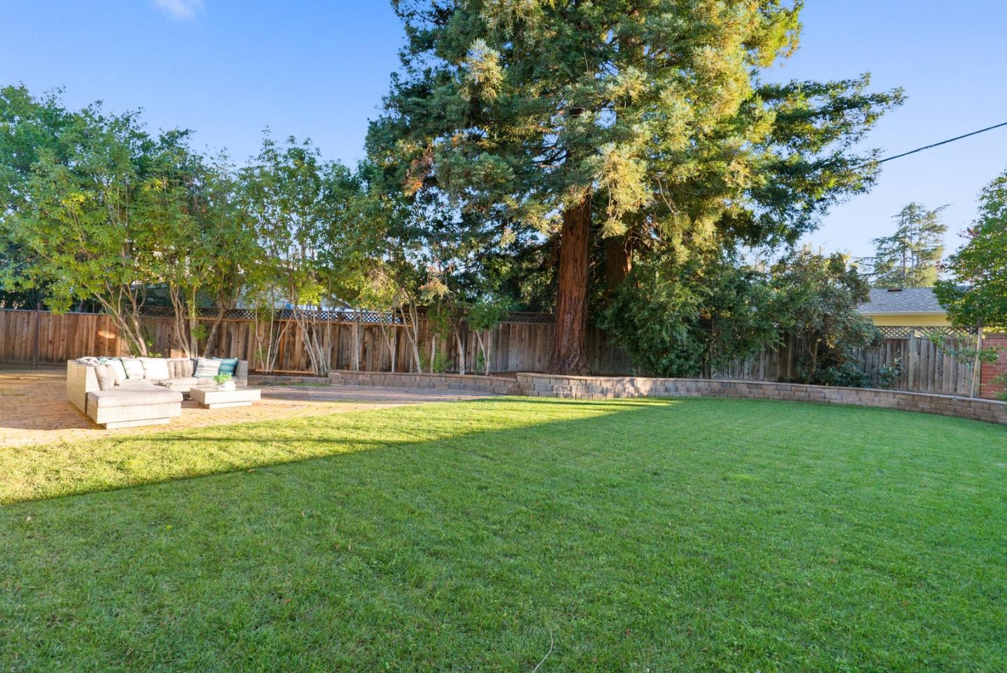 777 Rustic Lane Mountain View, CA 94040 - Photo 42 of 44 a swimming pool with outdoor seating and yard