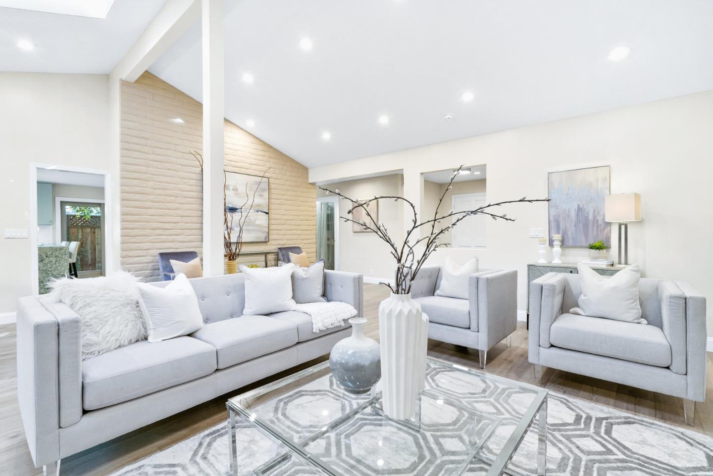 777 Rustic Lane Mountain View, CA 94040 - Photo 10 of 44 a living room with furniture and a large window