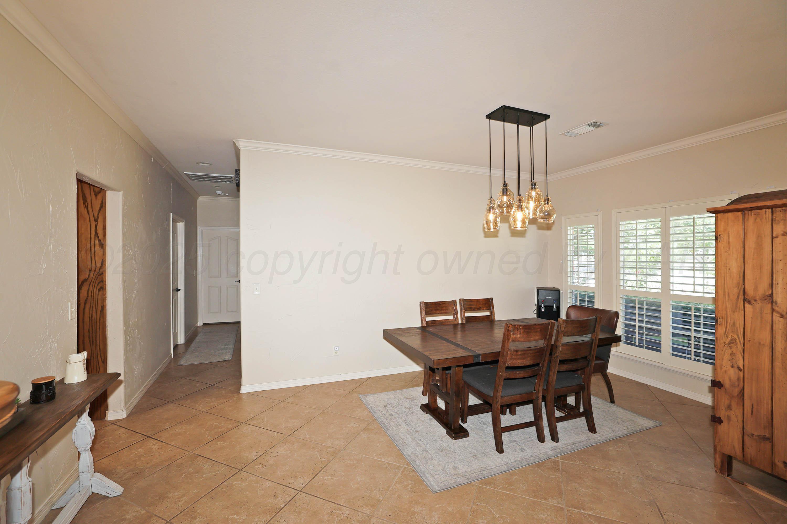 9220 Greyhawk Road Amarillo, TX 79119 - Photo 12 of 50 a view of a dining room with furniture window and outside view