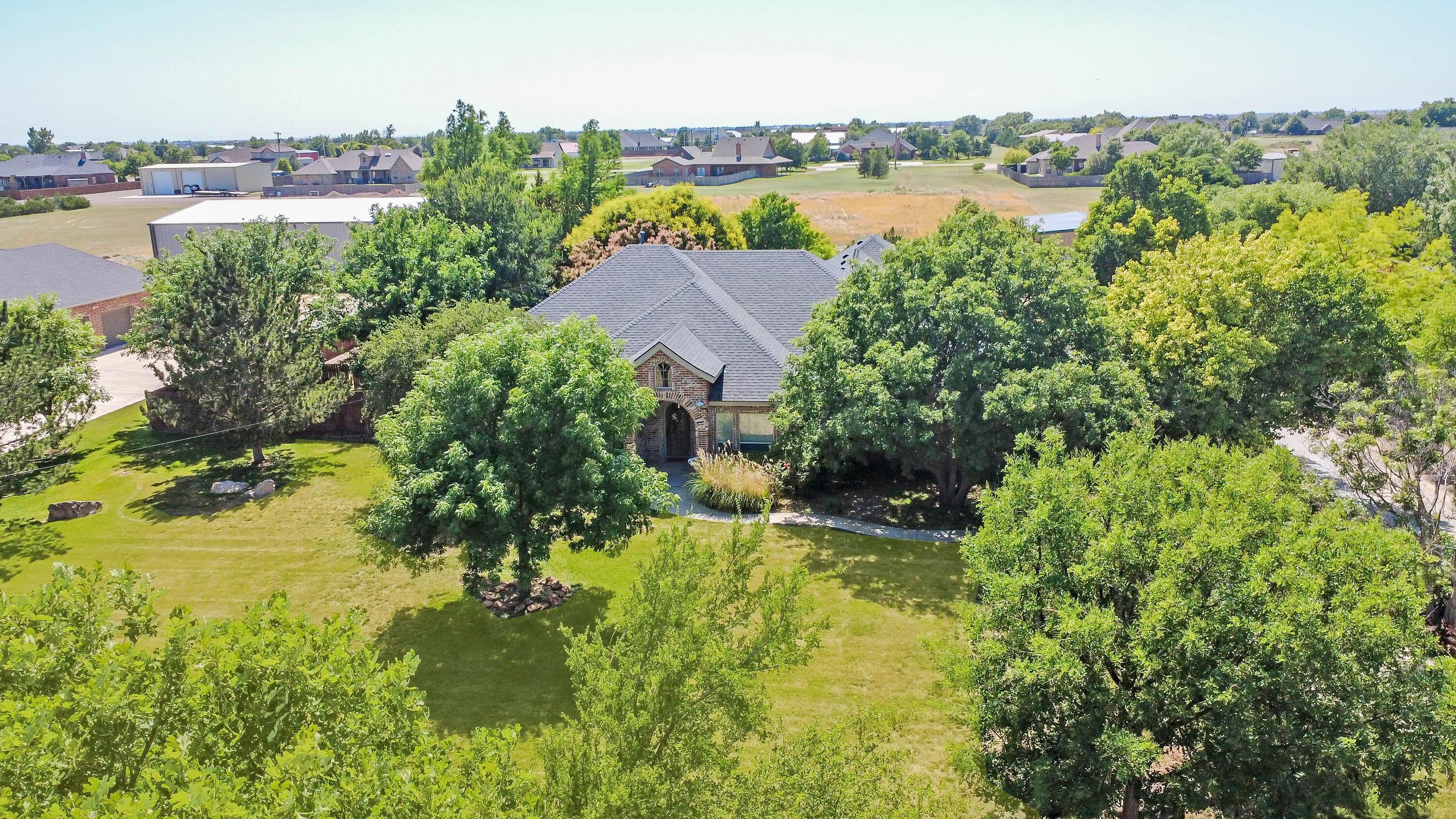 9220 Greyhawk Road Amarillo, TX 79119 - Photo 2 of 50 a view of a lake with a city