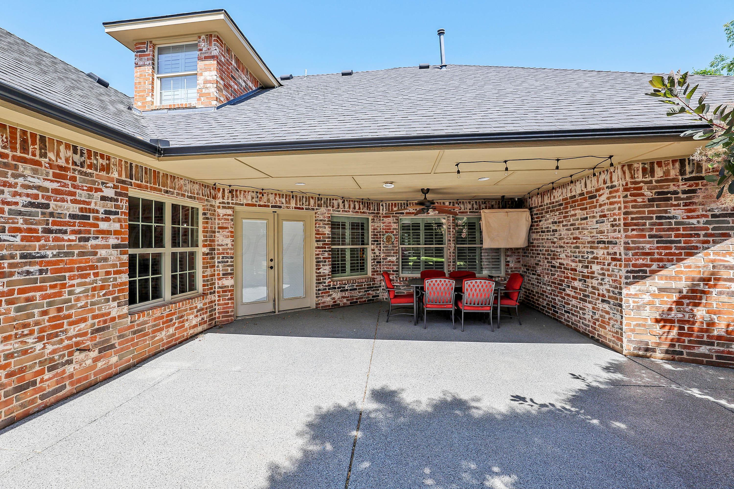 9220 Greyhawk Road Amarillo, TX 79119 - Photo 39 of 50 a view of a porch with a table and chairs