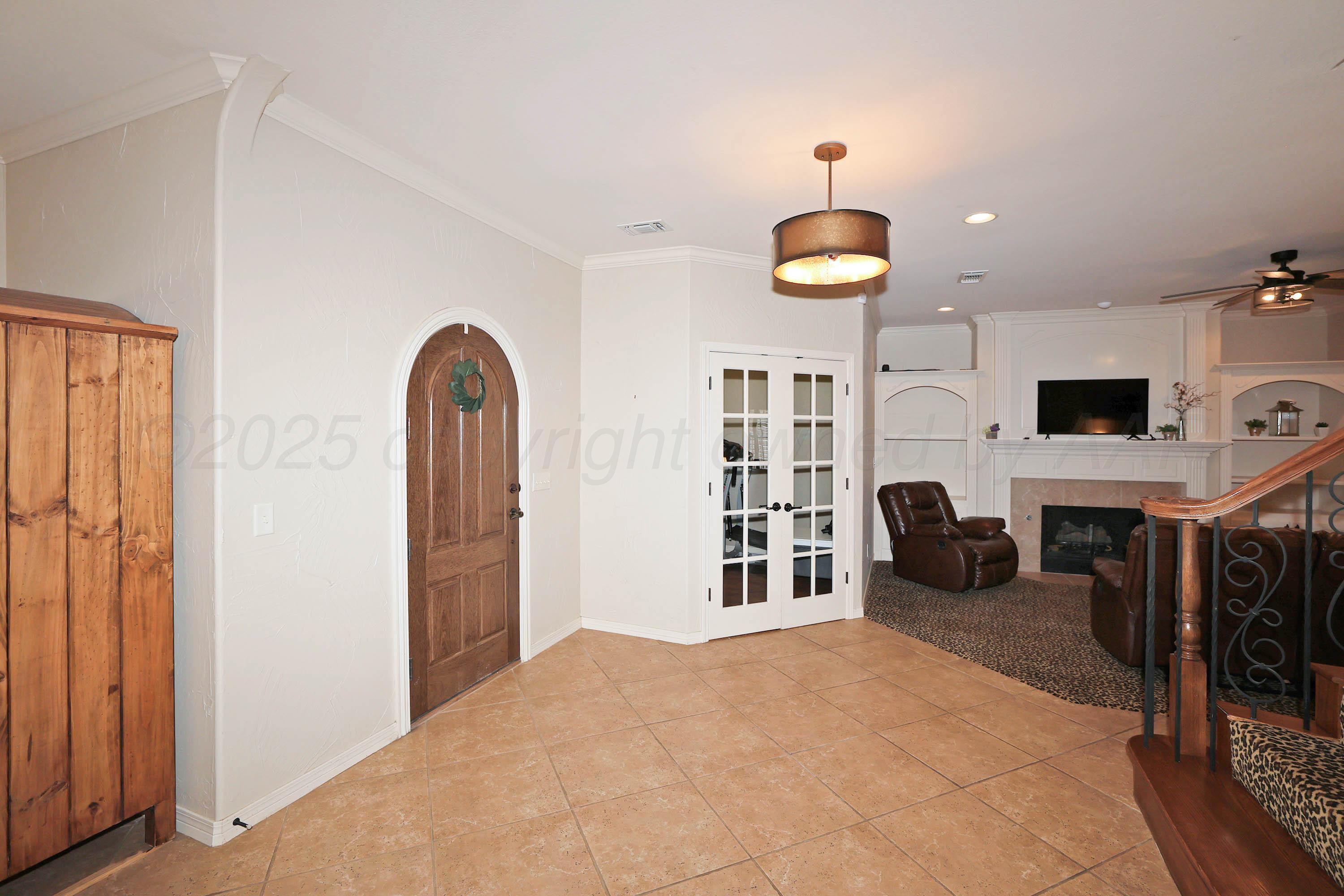 9220 Greyhawk Road Amarillo, TX 79119 - Photo 6 of 50 a view of a livingroom with furniture and staircase