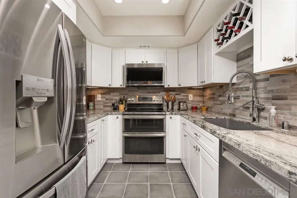 13955 Midland Road Poway, CA 92064 - Photo 11 of 25 a kitchen with a sink and a stove top oven