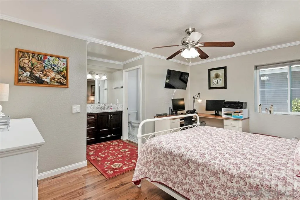 13955 Midland Road Poway, CA 92064 - Photo 15 of 25 a bedroom with furniture and a chandelier