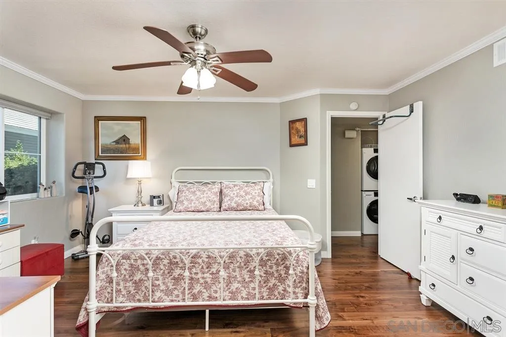13955 Midland Road Poway, CA 92064 - Photo 16 of 25 a bedroom with a bed and wooden floor