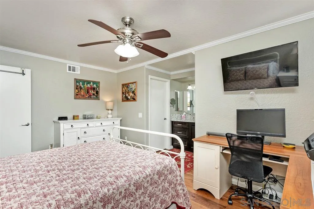 13955 Midland Road Poway, CA 92064 - Photo 17 of 25 a bedroom with a bed and a flat screen tv