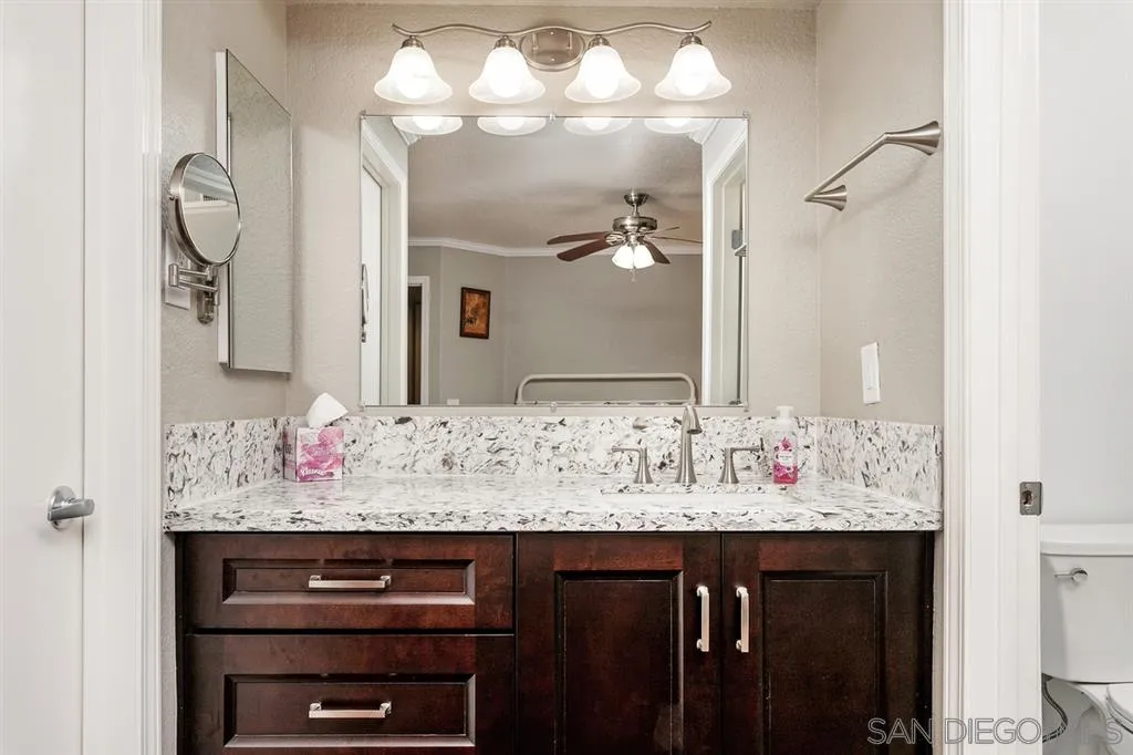 13955 Midland Road Poway, CA 92064 - Photo 18 of 25 a bathroom with a sink vanity and a mirror