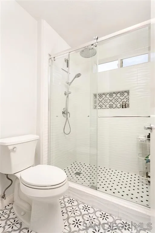 13955 Midland Road Poway, CA 92064 - Photo 20 of 25 a bathroom with a toilet and a shower