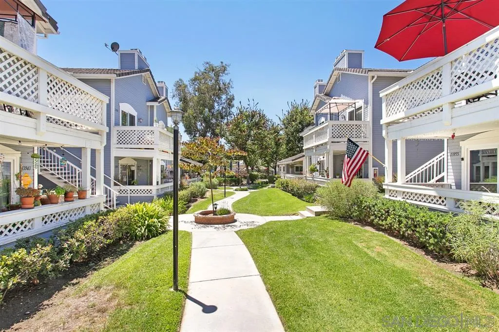 13955 Midland Road Poway, CA 92064 - Photo 2 of 25 a view of a white house with a yard and potted plants