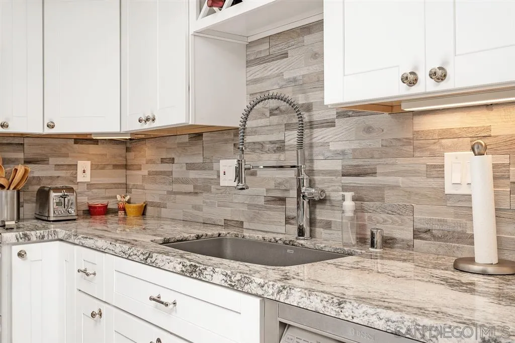 13955 Midland Road Poway, CA 92064 - Photo 9 of 25 a kitchen with granite countertop a sink and a stove
