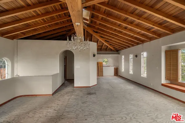 a view of an empty room with a windows