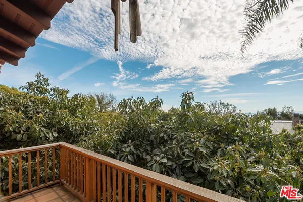 a view of outdoor space with deck and flat screen tv