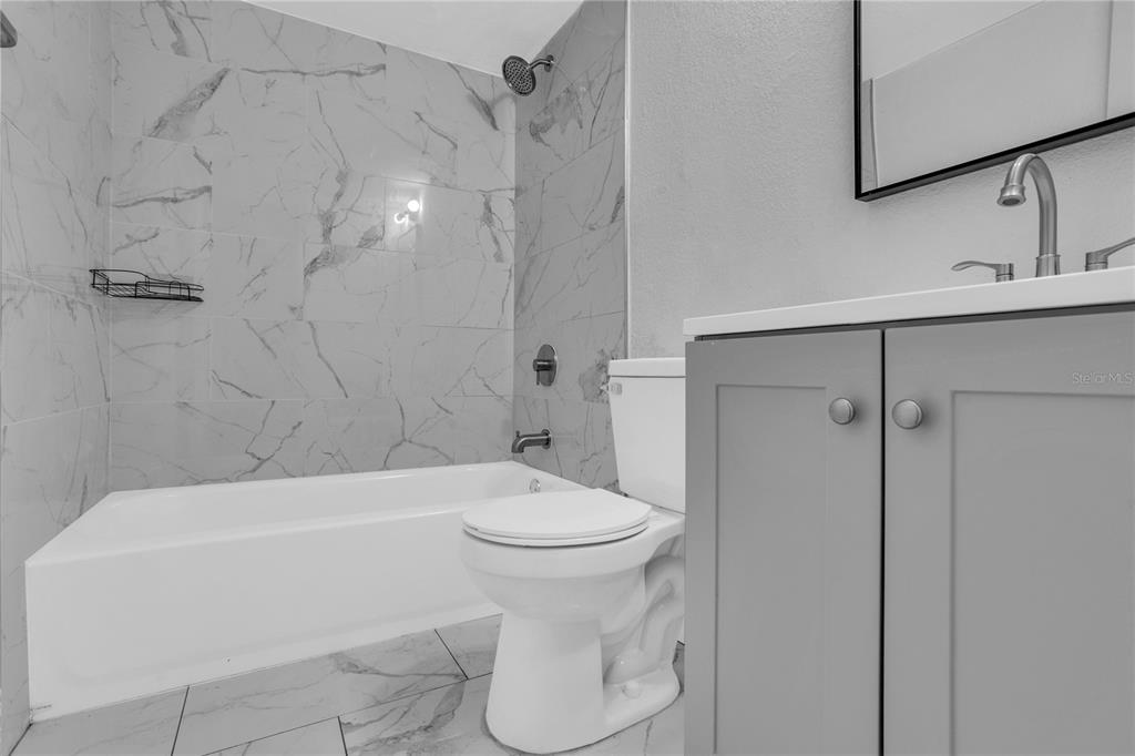 209 Red Cedar Place, Unit 209 Brandon, FL 33510 - Photo 25 of 56 a bathroom with a sink a toilet and shower