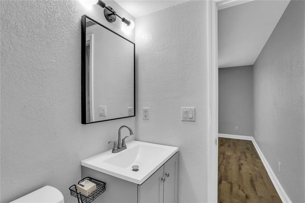 209 Red Cedar Place, Unit 209 Brandon, FL 33510 - Photo 26 of 56 a bathroom with a sink a toilet and mirror