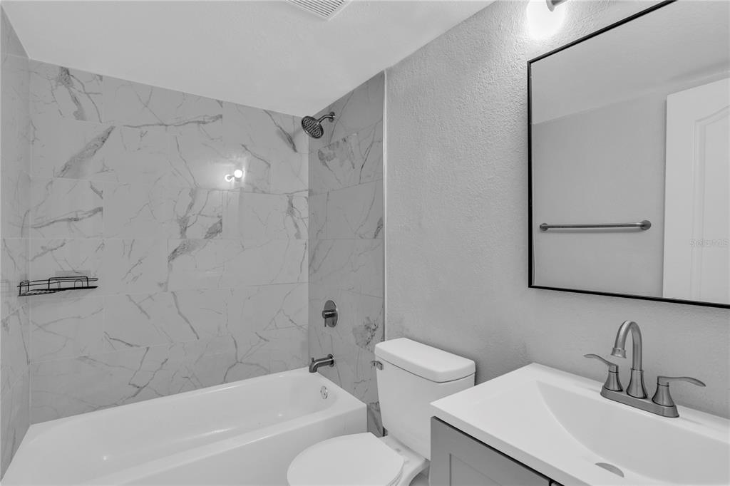 209 Red Cedar Place, Unit 209 Brandon, FL 33510 - Photo 27 of 56 a bathroom with a sink toilet and shower