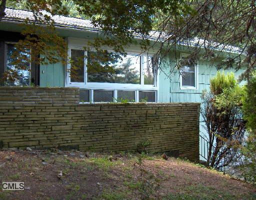 a view of a house with a tree