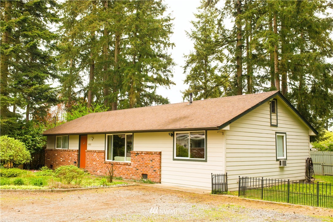 4503 Northeast 17th Place Renton, WA 98059 - Photo 1 of 21 a front view of a house with a yard