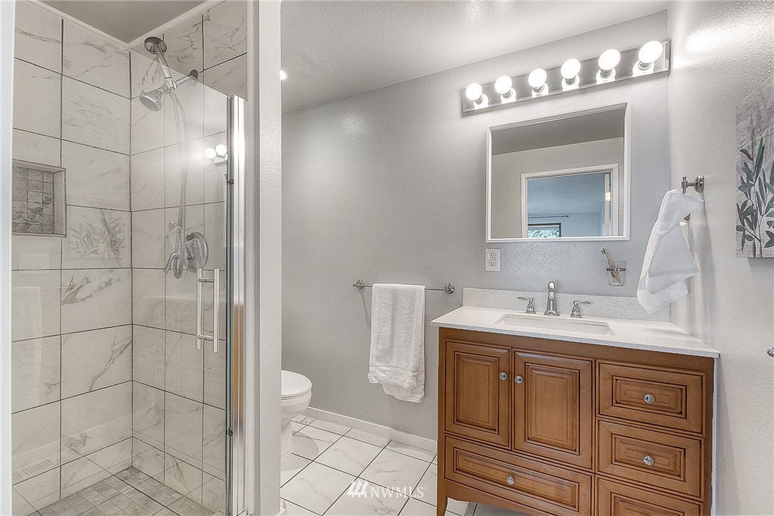 4503 Northeast 17th Place Renton, WA 98059 - Photo 13 of 21 a bathroom with a sink a toilet and shower