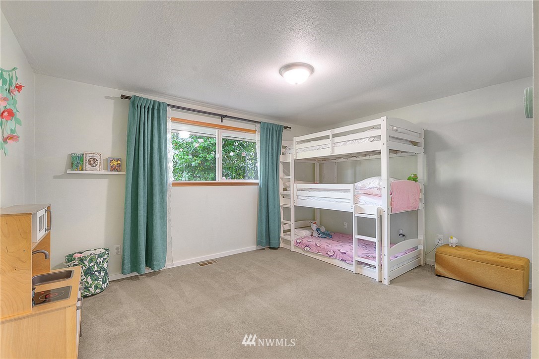 4503 Northeast 17th Place Renton, WA 98059 - Photo 14 of 21 a bedroom with bed and a window