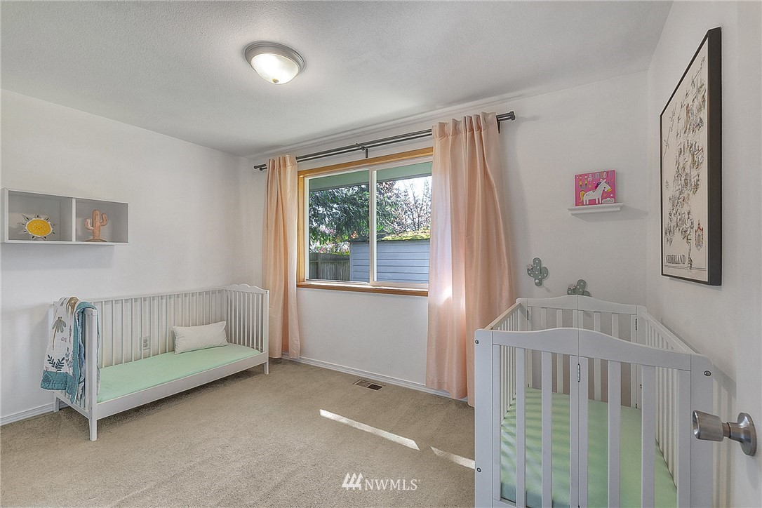 4503 Northeast 17th Place Renton, WA 98059 - Photo 16 of 21 a bedroom with a bed and a window