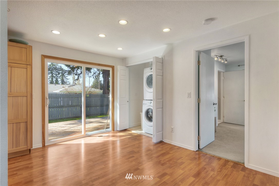 4503 Northeast 17th Place Renton, WA 98059 - Photo 6 of 21 a view of an empty room with wooden floor and a window