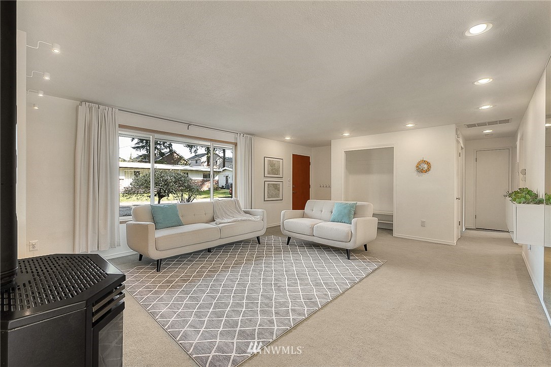 4503 Northeast 17th Place Renton, WA 98059 - Photo 10 of 21 a living room with furniture and a large window