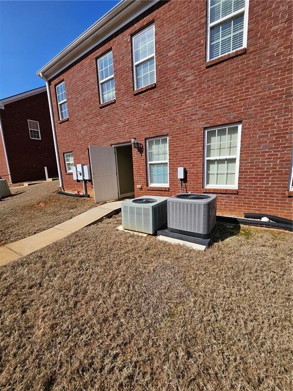 101 Devant Street, Unit 901 Fayetteville, GA 30214 - Photo 13 of 14 a front view of a house with a yard