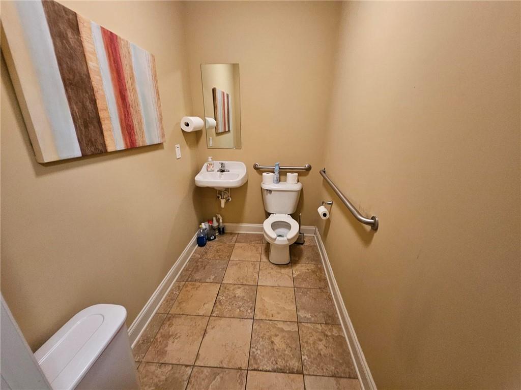 101 Devant Street, Unit 901 Fayetteville, GA 30214 - Photo 14 of 14 a bathroom with a sink and a toilet