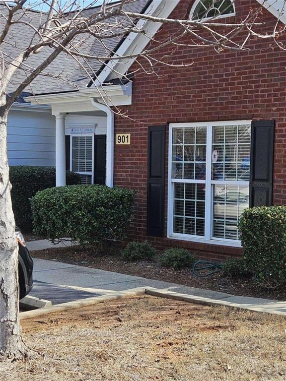 101 Devant Street, Unit 901 Fayetteville, GA 30214 - Photo 2 of 14 a front view of a house with a yard