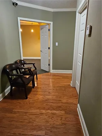 a room with wooden floor and furniture