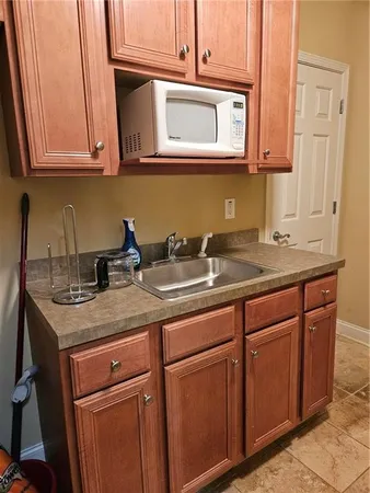 a kitchen with stainless steel appliances granite countertop a sink and dishwasher