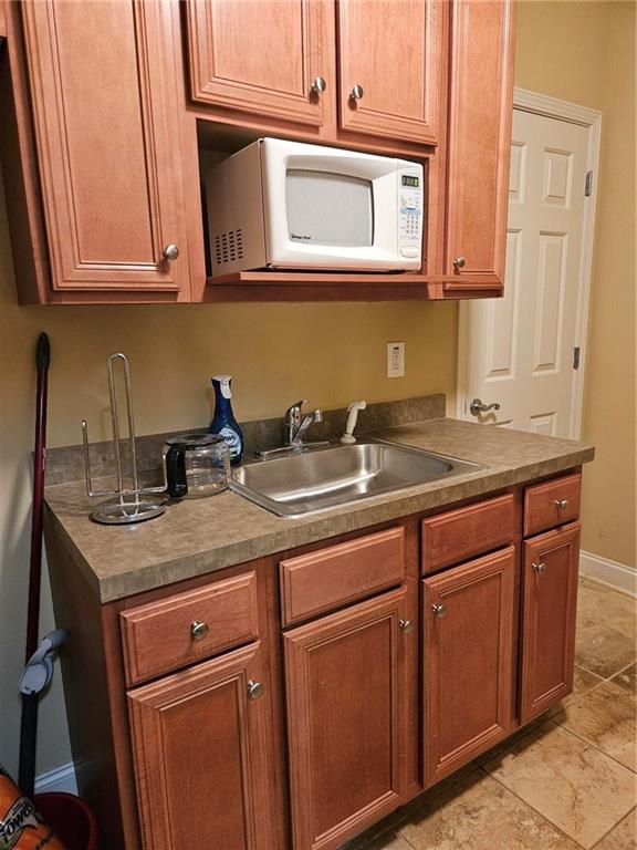 101 Devant Street, Unit 901 Fayetteville, GA 30214 - Photo 8 of 14 a kitchen with stainless steel appliances granite countertop a sink and dishwasher