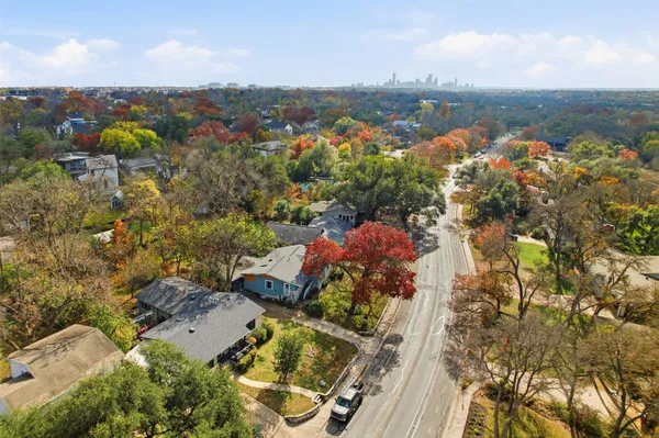 an aerial view of residential houses with outdoor space