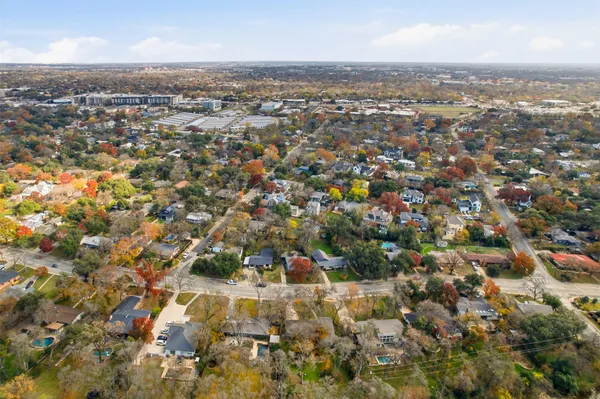 a view of a swimming pool with a table and chairs