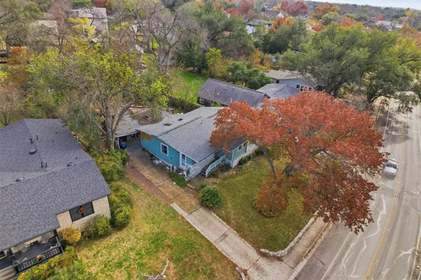 an aerial view of house with yard