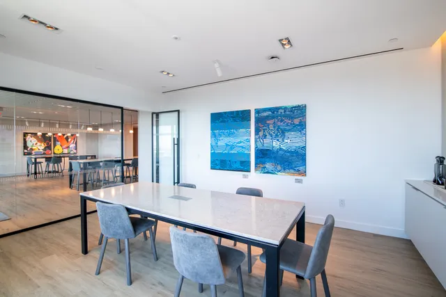 a view of a dining room with wooden floor