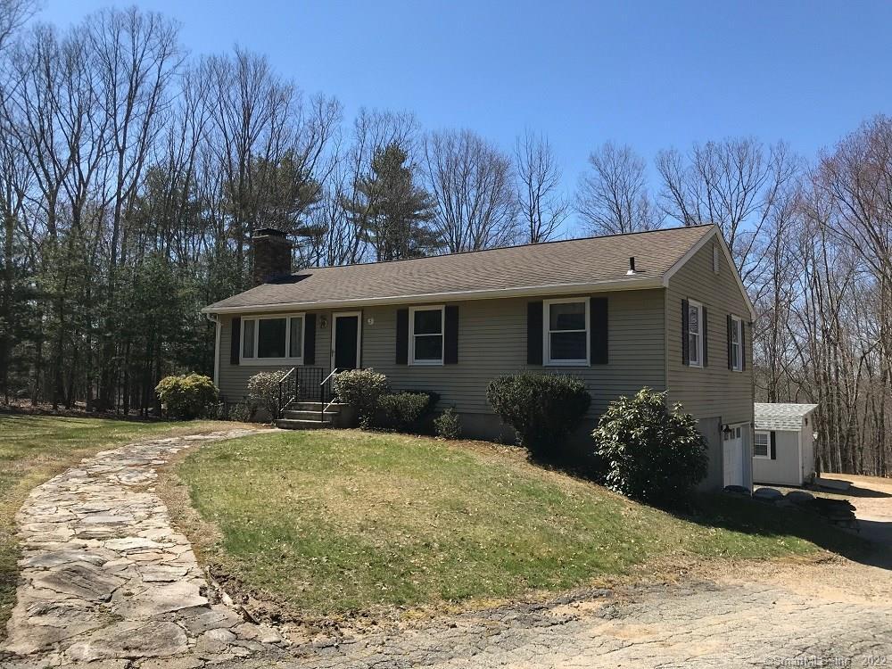 3 Newberry Road Columbia, CT 06237 - Photo 1 of 1 a front view of a house with garden