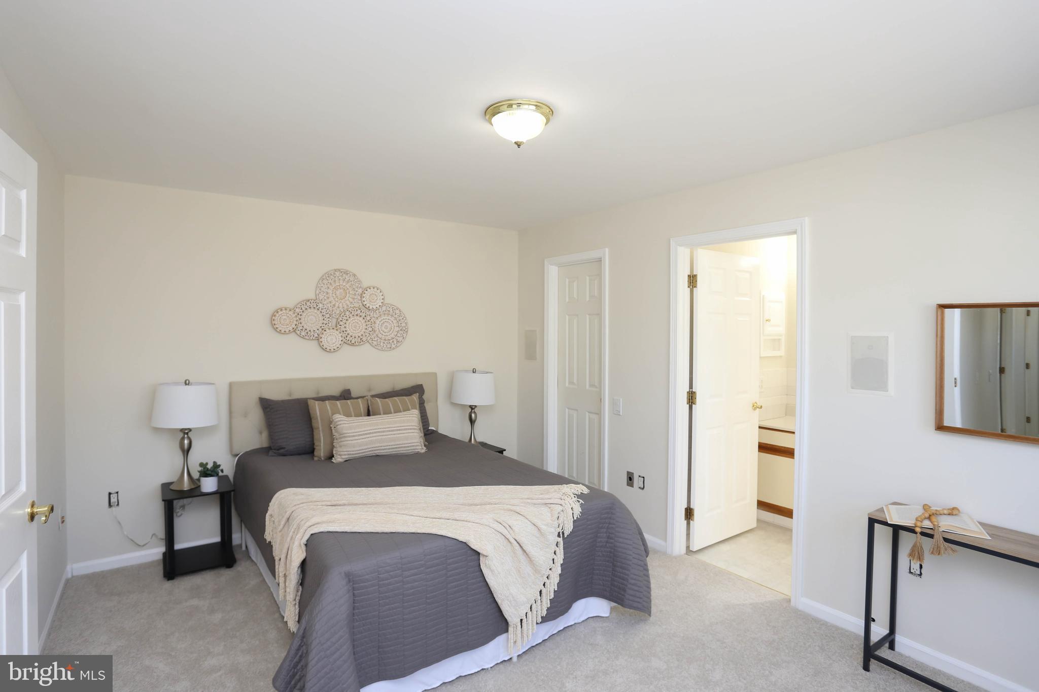 7629 Bluff Point Lane Elkridge, MD 21075 - Photo 13 of 31 a bedroom with a bed and a cabinets