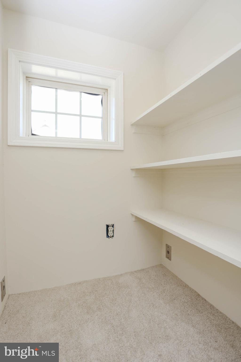 7629 Bluff Point Lane Elkridge, MD 21075 - Photo 16 of 31 a view of an empty room with a window