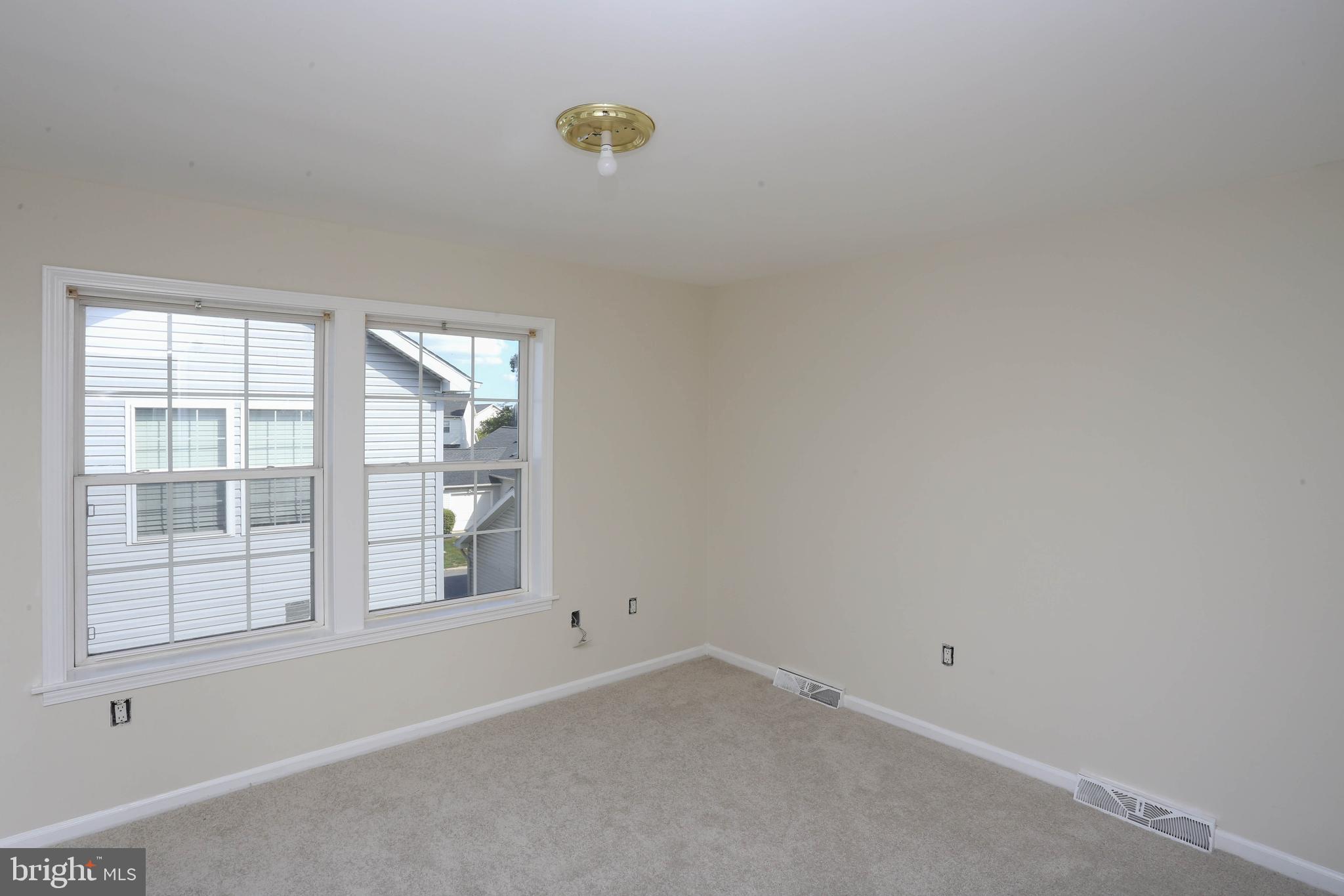 7629 Bluff Point Lane Elkridge, MD 21075 - Photo 17 of 31 an empty room with windows