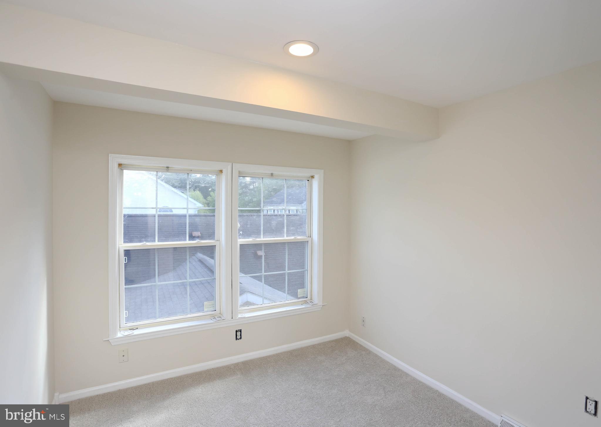 7629 Bluff Point Lane Elkridge, MD 21075 - Photo 21 of 31 an empty room with windows