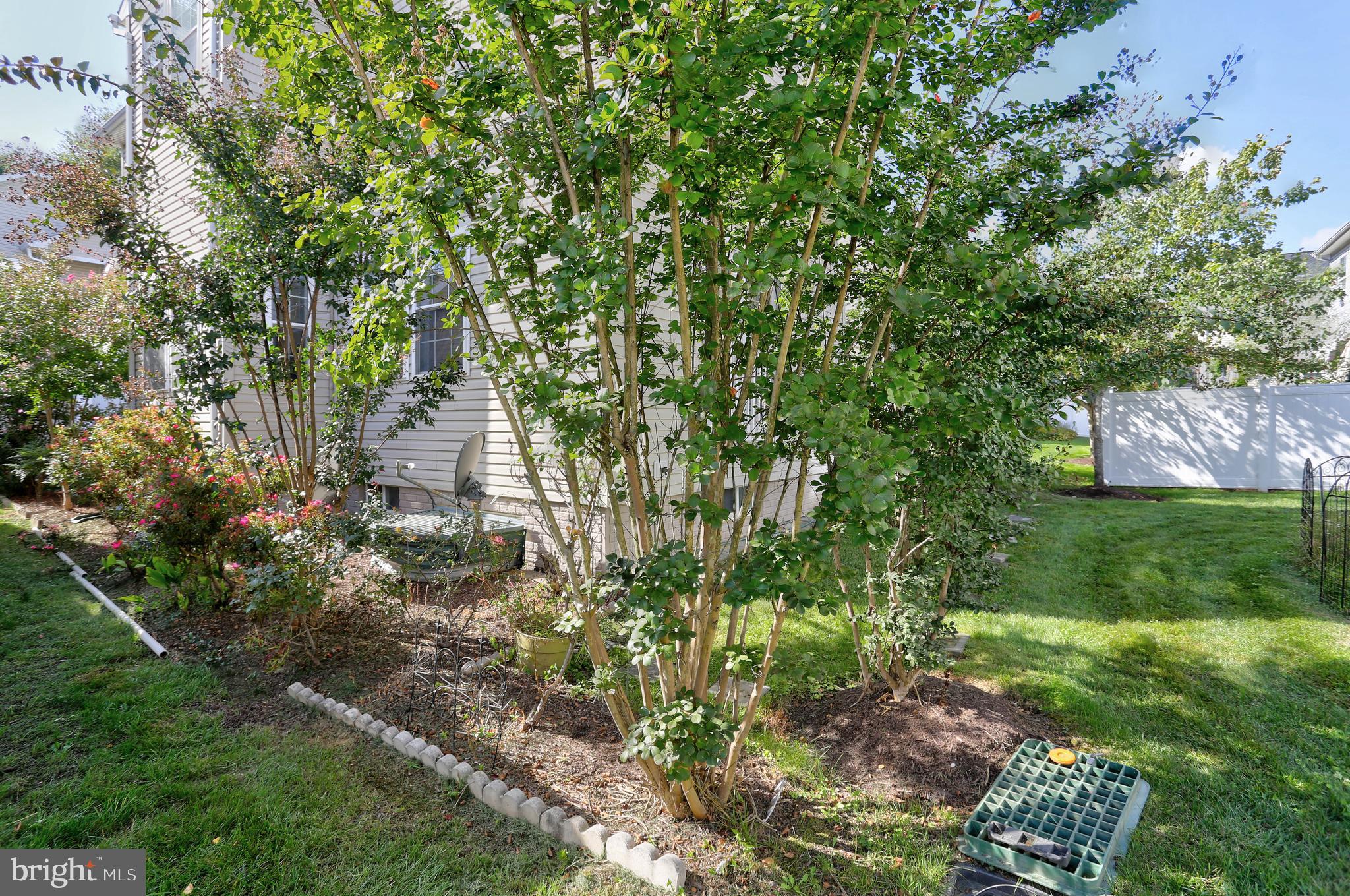 7629 Bluff Point Lane Elkridge, MD 21075 - Photo 22 of 31 a backyard of a house with lots of green space